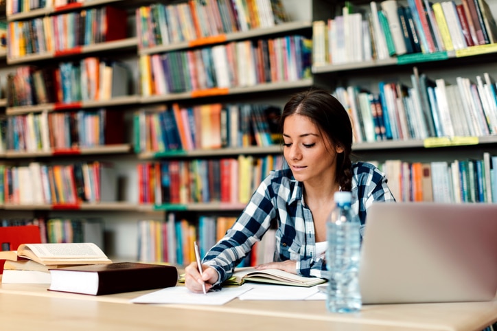 Student using laptop for taking notes to study